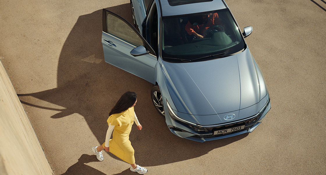 Closer view at the front part of Hyundai car with its logo and grille