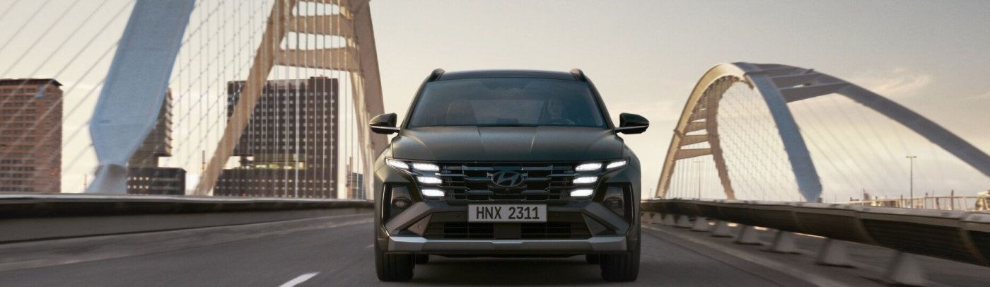 Closer view at the front part of Hyundai car with its logo and grille